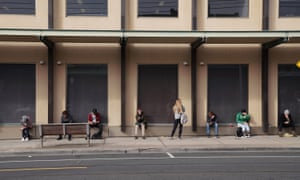 People queue outside a Centrelink office in Preston, Melbourne, in March