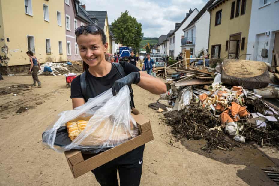 A helper distributes cake baked by other helpers.