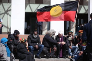 The member for Kennedy Bob Katter talks to talks to Daniel Boney, holding the flag and Herbert Bropho, at a welcome for Clinton Pryor after he completed his 5581km walk for justice from Perth. Ceremony held on the forecourt of Parliament House, Canberra this afternoon, Tuesday 5th September 2017.