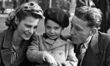 Charlie Watts aged 2 with his mother, Lillian, and father, Charles, in Piccadilly Circus in 1943.