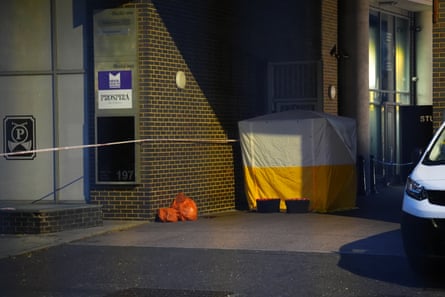 A forensic tent sits next to a building in south London.