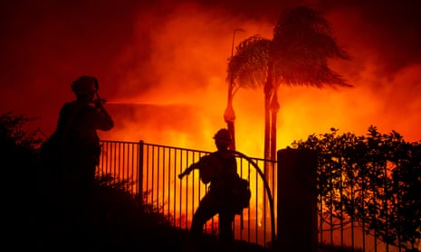 Firefighters work at controlling the spread of the Blue Ridge fire threatening homes in Yorba Linda, Orange county, south of Los Angeles, on Monday.