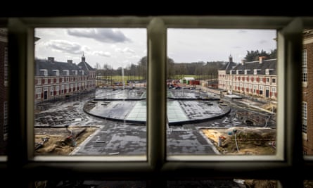 A view from inside the palace shows the courtyard under construction.