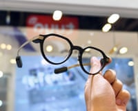 a person holding Even Realities G2 smart glasses