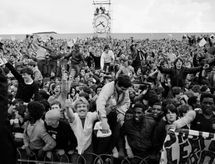 Villa fans begin to celebrate in the Clock End at Highbury after hearing that Ipswich were on the verge of a 2-1 defeat to Middlesbrough.