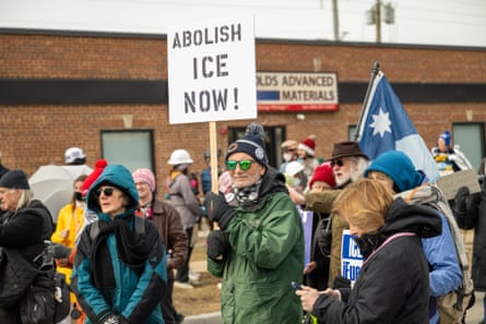 people hold up signs in protest