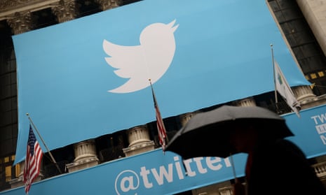 The Twitter logo on the front of the New York Stock Exchange. Daily account suspensions are up 80% on previous year, the company says. 