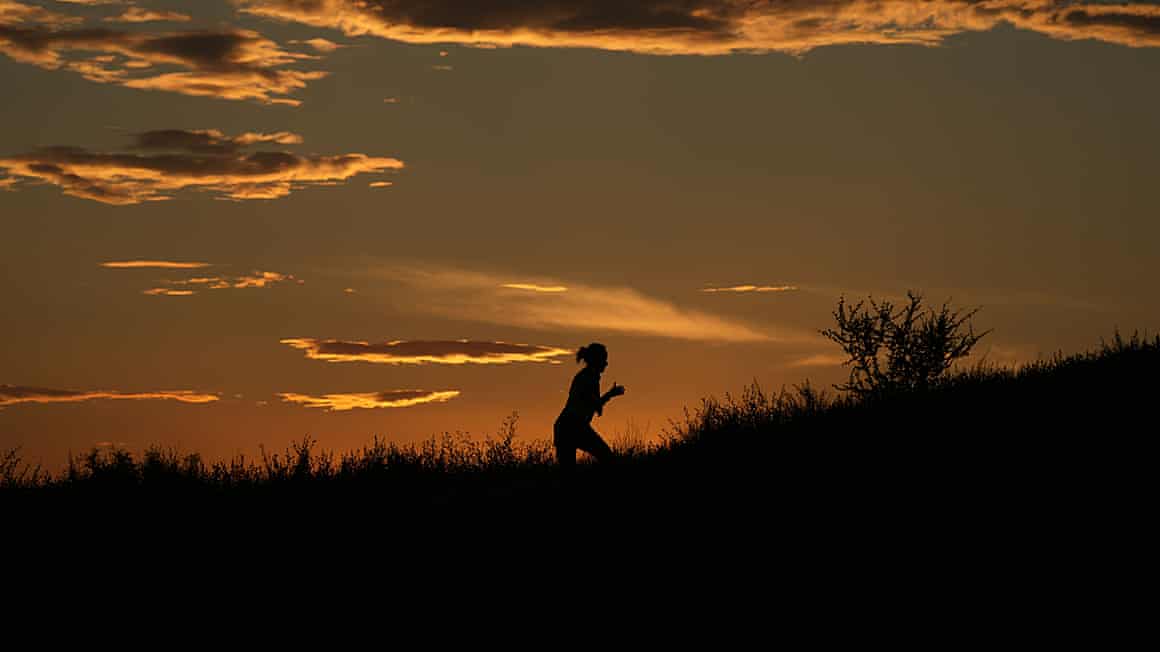 Sunset and person running