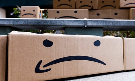 Boxes with a reimagined Amazon logo during a protest over the company opening one of two new headquarters in New York.