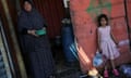 Palestinians wait to receive food cooked by a charity kitchen in Rafah.