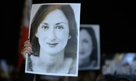 Protesters hold pictures of Daphne Caruana Galizia in Valletta, Malta.