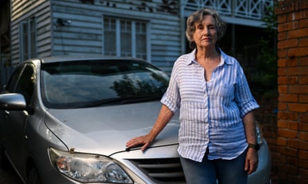 Evelyn Trueman standing in front of her car, parked in front of her home