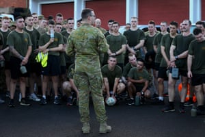 Australian defence emergency support team personnel assemble for an early morning briefing at Macquarie Barracks.
