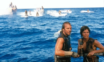 Kevin Costner and Jeanne Tripplehorn in the water