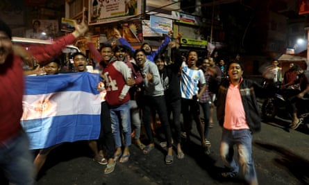 Supporters of Argentina in Kolkata, India celebrate in the street after the semi-final win over Croatia.