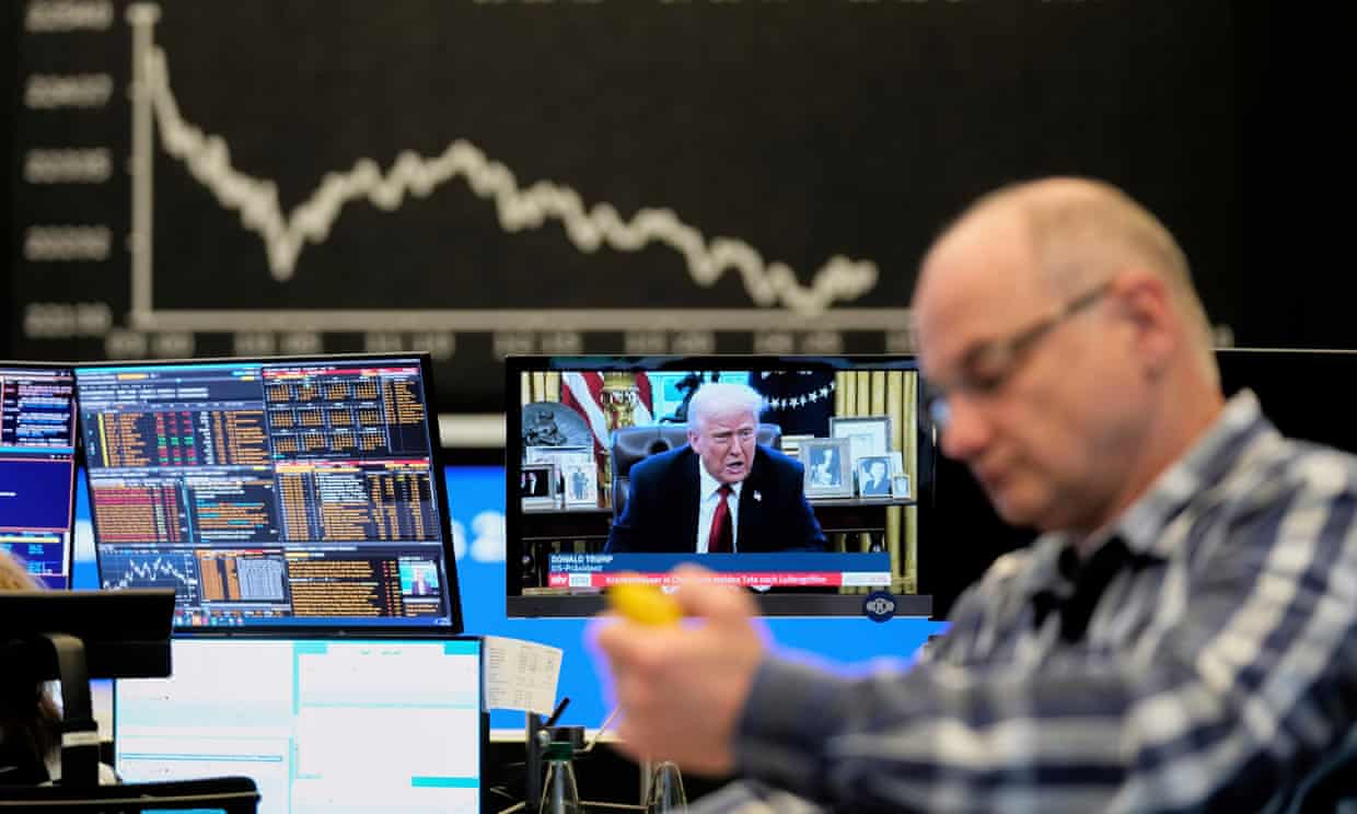 Us President Donald Trump appears on a television screen at the stock market in Frankfurt, Germany.