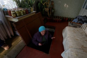 Nikopol, Ukraine. Nataliia Chopova emerges from a shelter where she and her husband, Oleksandr, sleep every night amid constant military attacks on the city by Russia