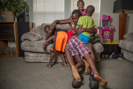 Jaron McNealy, 28, with his children at his mother’s home.
