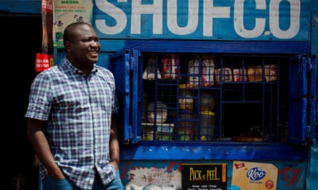 Kennedy Odede, a social entrepreneur, who is co-founder of Shining Hope for Communities, (SHOFCO) a non-profit organisation that tackles urban poverty and gender inequity in the slums of Nairobi poses for a photograph outside a shop with the orgnaisations name in Kibera Slum, Nairobi, Kenya Monday, April 29, 2019. Kibera is one of the largest slums in Africa and is home to an estimated 500,000 people most of whom live on less than one dollar a day.