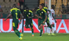 Senegal's Abdou Diallo celebrates scoring their first goal with team-mates.