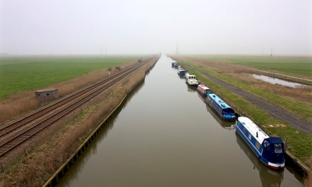 Waterway, disappearing to horizon, with boats