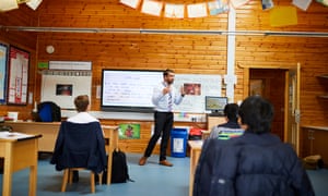 Year six pupils in a literacy lesson at Manchester Grammar School being taught in small bubbles in line with the government imposed restrictions during the Covid-19 pandemic. Christopher Thomond for The Guardian.