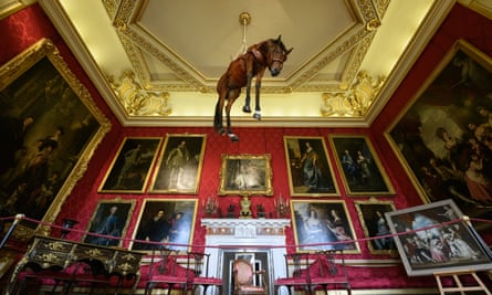 ‘No pride, no life, no energy’ … a taxidermy horse suspended from the ceiling.