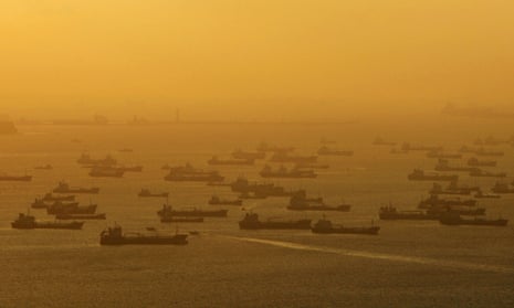Shipping vessels and oil tankers line up on the eastern coast of Singapore.