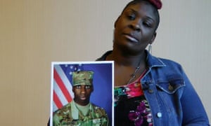 April Pipkins holds a photograph of her deceased son, Emantic ‘EJ’ Bradford Jr in Birmingham, Alabama on 27 November 2018. 2000.jpg?width=300&quality=85&auto=forma