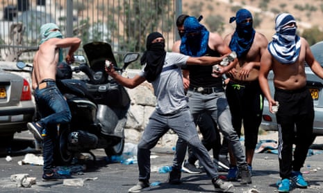 Palestinians throw rocks