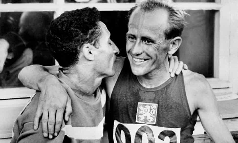 1952: Zatopek, with his friend, the French runner Alain Mimoun, who finished second to him in the Helsinki Olympic Games 5k. 