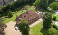 Aerial view of large house and outbuildings
