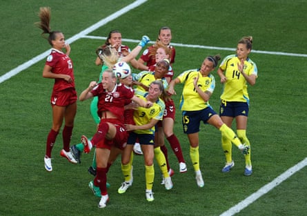 Denmark and Sweden players battle for the ball from a set piece