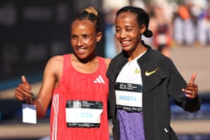 Workenesh Edesa and Sifan Hassan pose for photographs