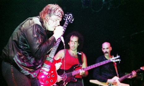 Steve Buslowe, centre, performing with Meat Loaf
