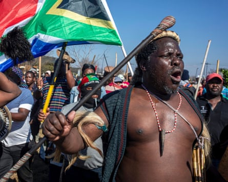 Hundreds of local people march in Soweto.