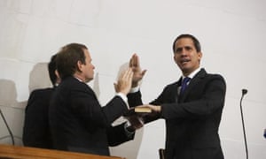 Guaidó takes the oath inside the parliament building.