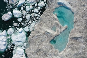 Melting ice forms a lake on free-floating ice jammed into Ilulissat Icefjord