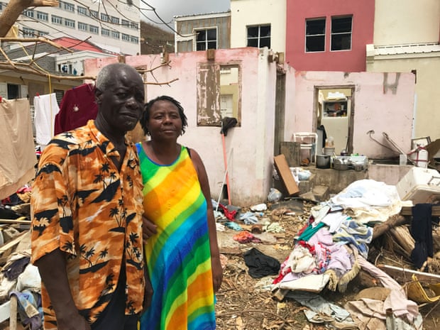 Dorothy and Alvin Nibbs stand by their destroyed home in Tortola.