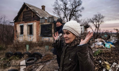 Local residents return to their damaged houses in the village of Bohorodychne, eastern Ukraine