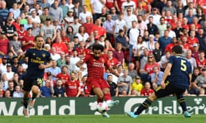 Salah pushes the ball in for his second.