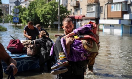 Police evacuate section residents from a flooded country aft the Nova Kakhovka dam breached, successful Kherson.