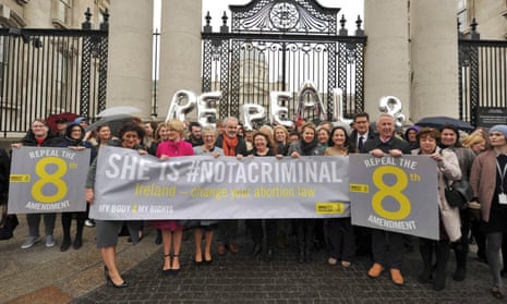 Campaigners hold a banner outside government buildings in Dublin calling for a change to Ireland’s abortion laws.