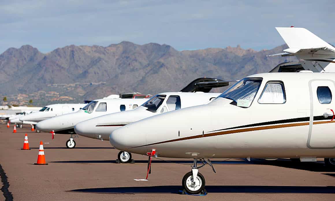 A row of private jets parked at Scottsdale airport in Arizona