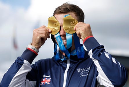 Clarke celebrates with his two gold medals after winning the men’s kayak cross at the 2023 the ICF Canoe Slalom World Championships.