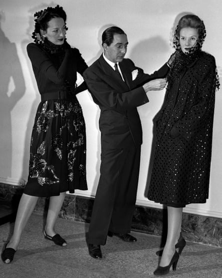 Norman Norell, the brilliant Indiana-born designer, displays two creations at the Metropolitan Museum of Art in 1943.