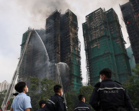 Smoke rising from the residential buildings as firefighters continue extinguishing the blaze