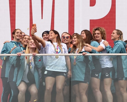 England players pose for a group selfie on stage.