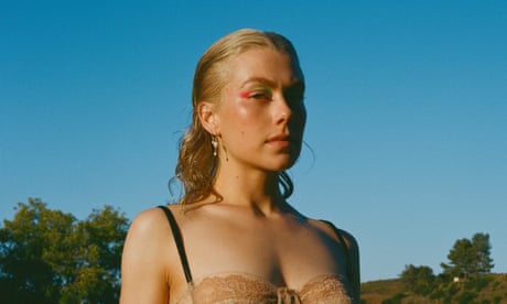 Phoebe Bridgers photographed on a golf course