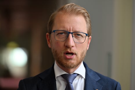 A man with short blond hair and glasses